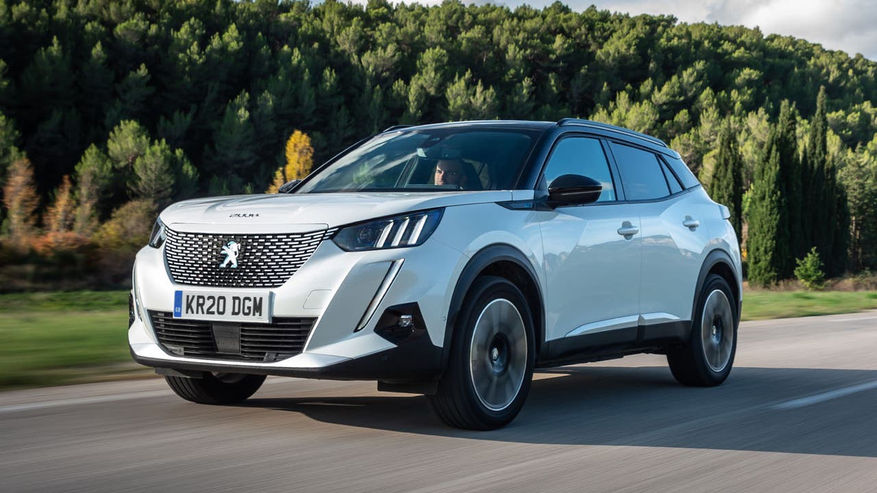 White Peugeot 2008 driving