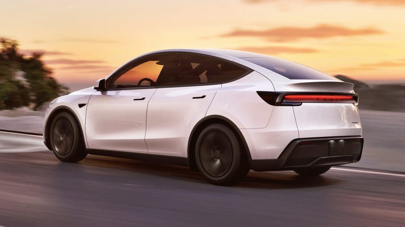 White Tesla Model Y facelift, driving rear sunset