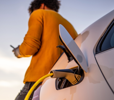 Electric vehicle plugged in for charging