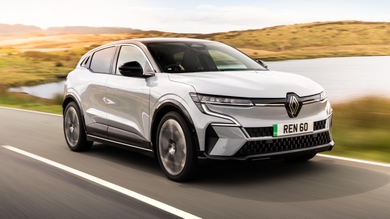 Renault Megane E-Tech driving past a lake