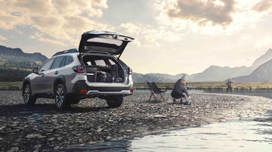 Subaru Outback with boot open in scenic location
