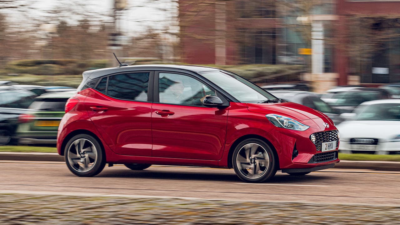 Hyundai i10 in red, driving shot