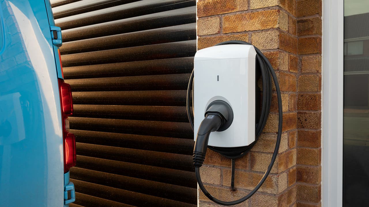 A wall-mounted EV charger