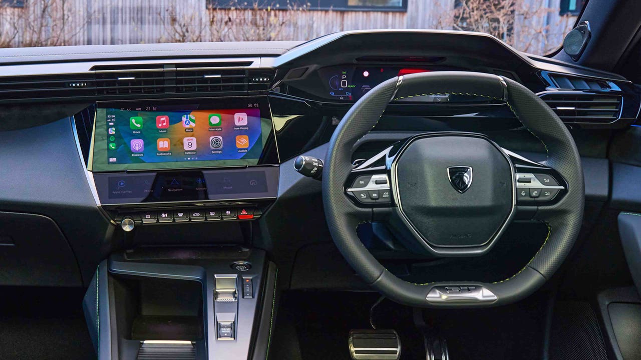 Peugeot 408 interior with Apple CarPlay shown on touchscreen