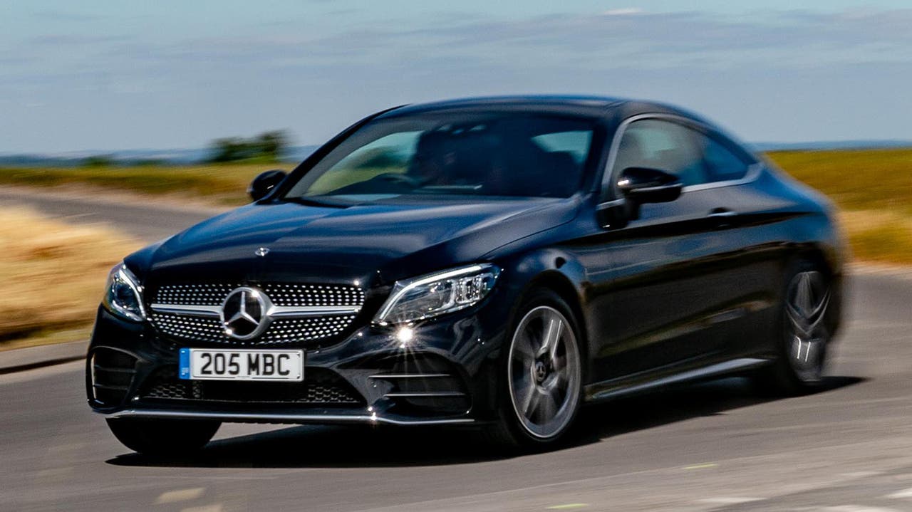 Mercedes C-Class Coupe in black, driving shot