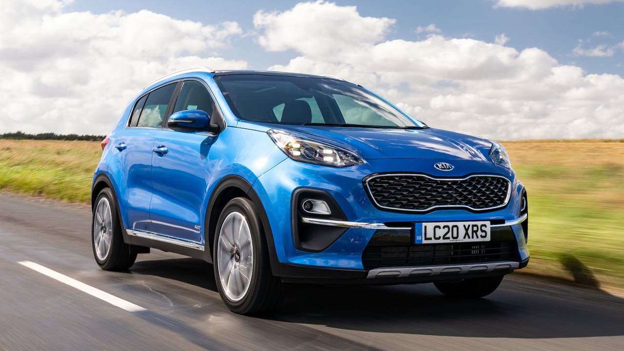 Kia Sportage in blue, driving shot