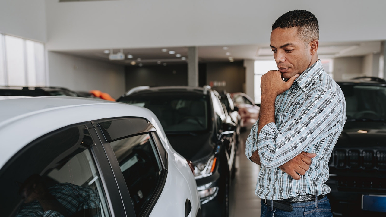 Driver looking inquisitively at a car