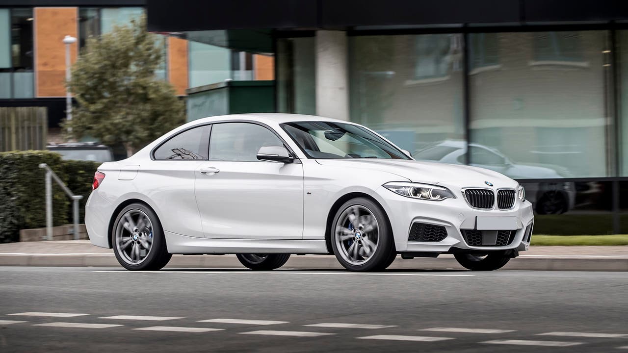 BMW M240i in white, driving shot