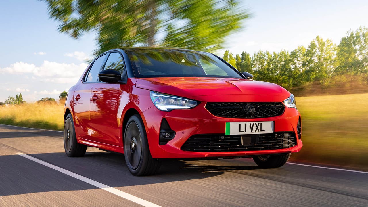 Vauxhall Corsa in red, driving shot