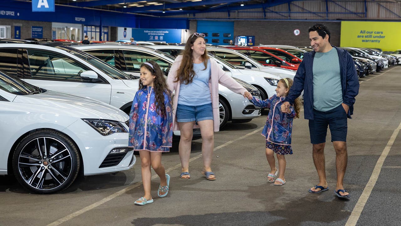 Car-shopping family at a Motorpoint store