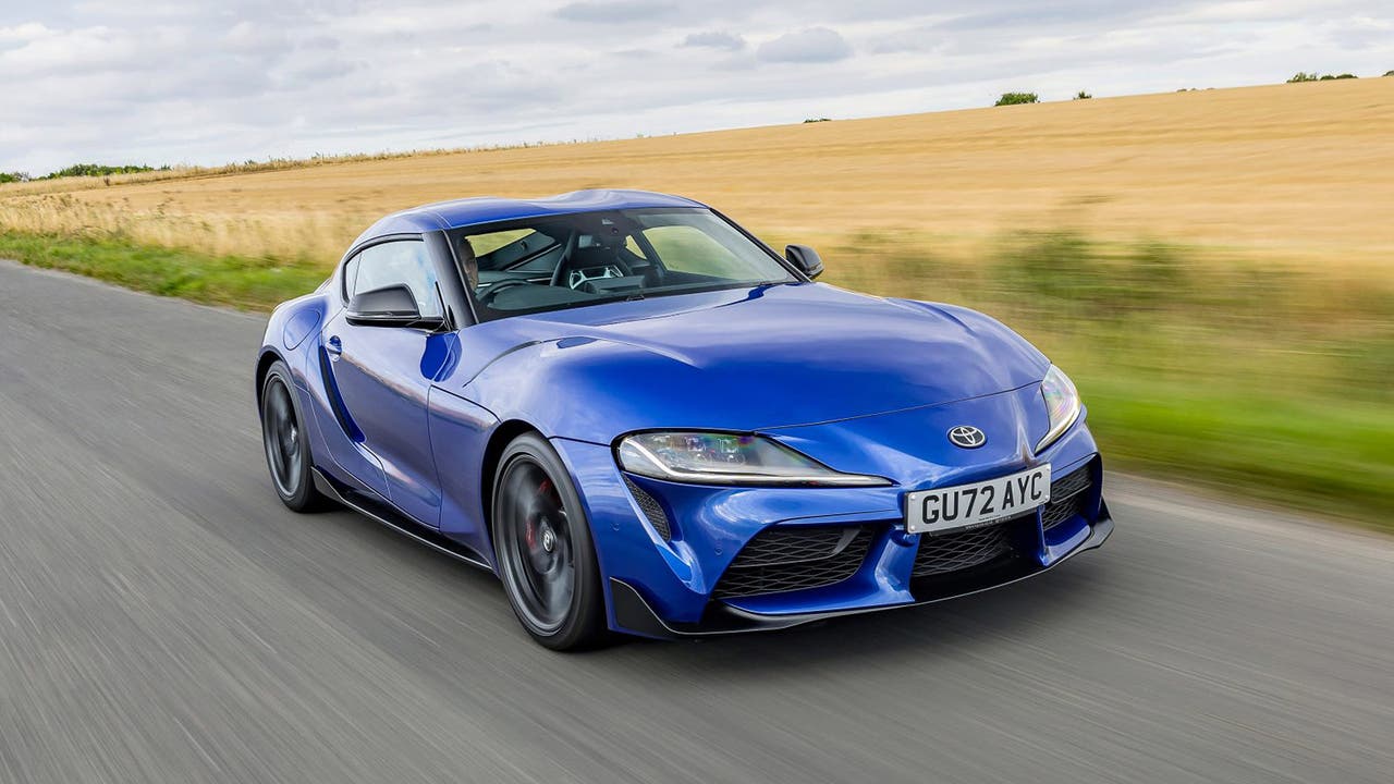 Toyota GR Supra in blue, driving shot