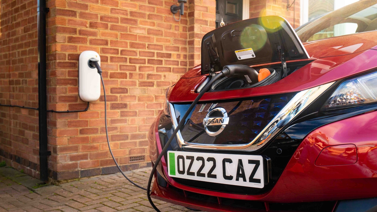 Nissan Leaf plugged into home charger