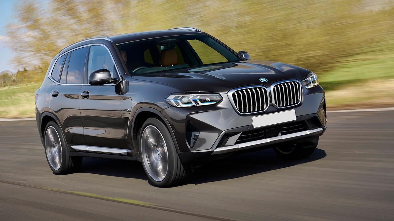 Grey BMW X3 driving along a country road