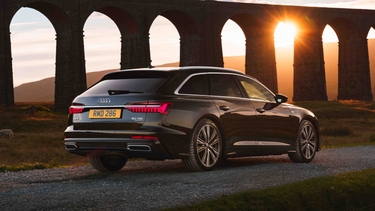 Audi A6 Avant S Line, rear, in front of viaduct