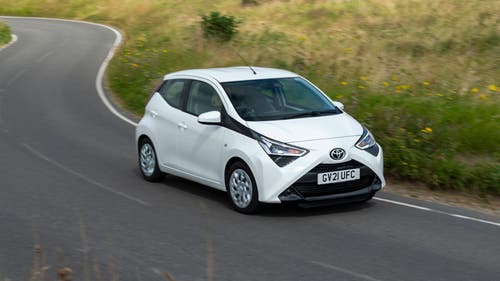 Toyota Aygo driving around corner