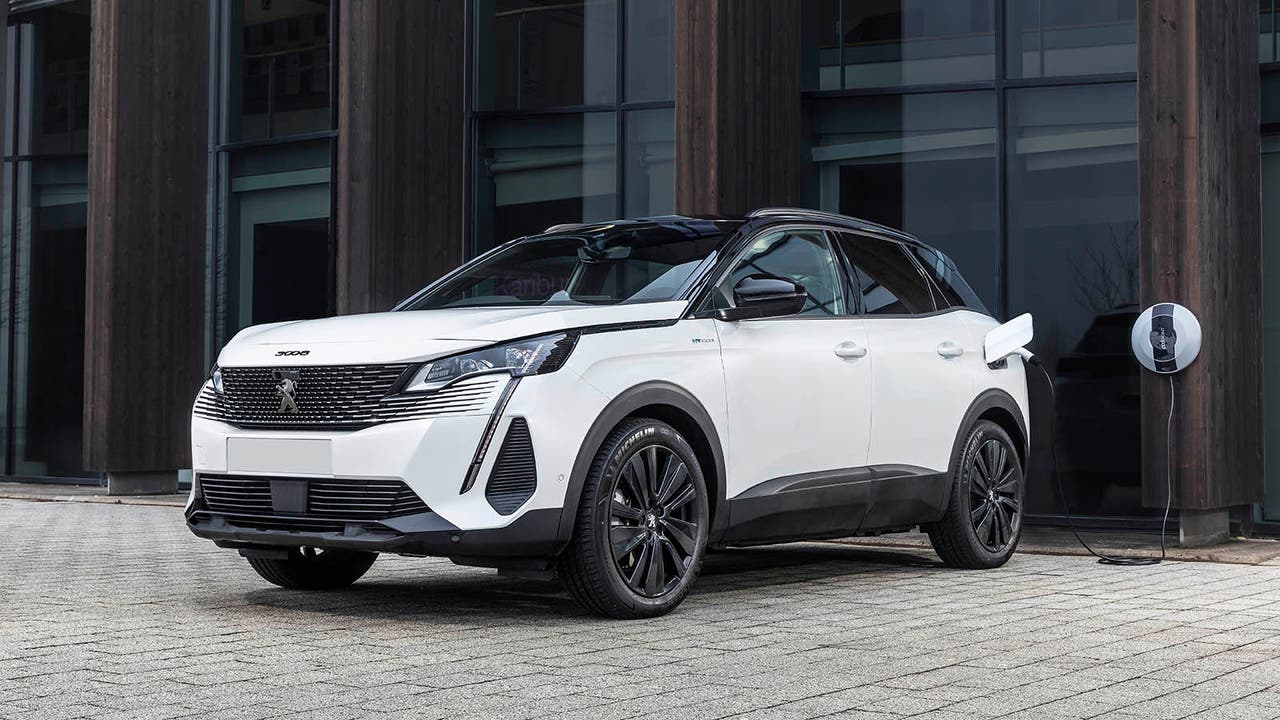 Peugeot 3008 Hybrid4 in white, charging shot