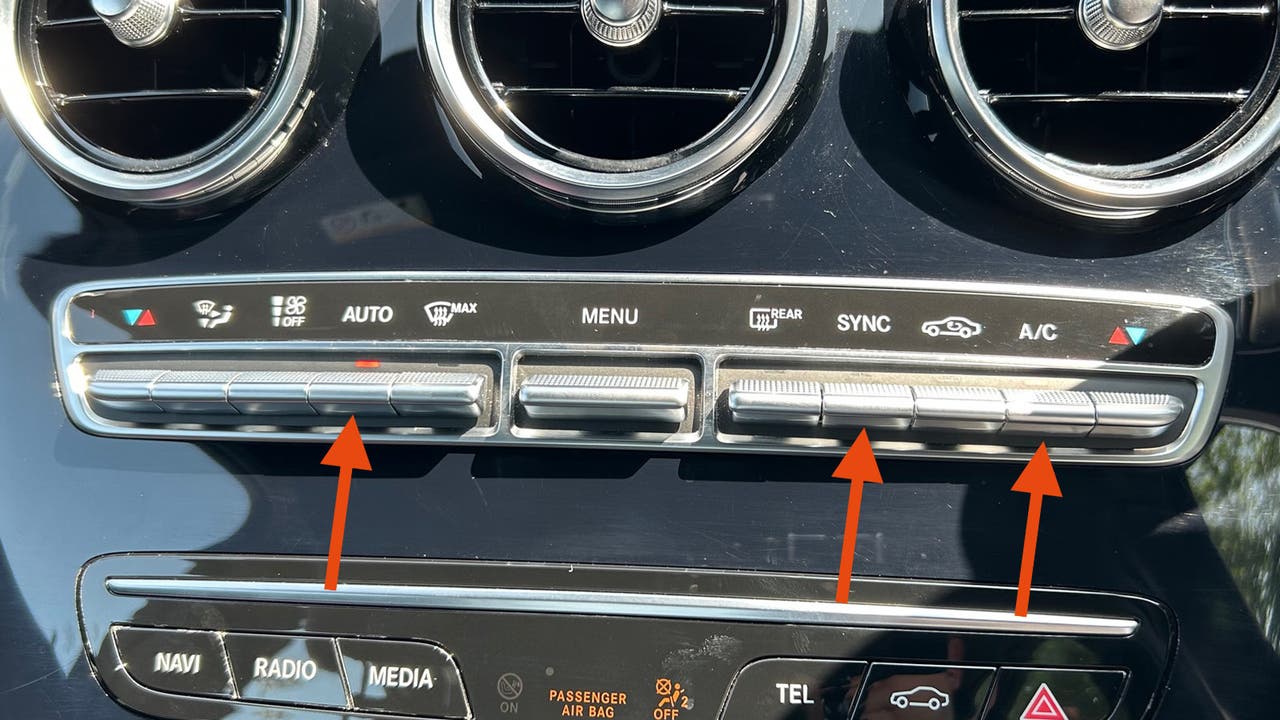 Mercedes C-Class, how to turn the AC on. Climate controls shown with arrows highlighting main features.