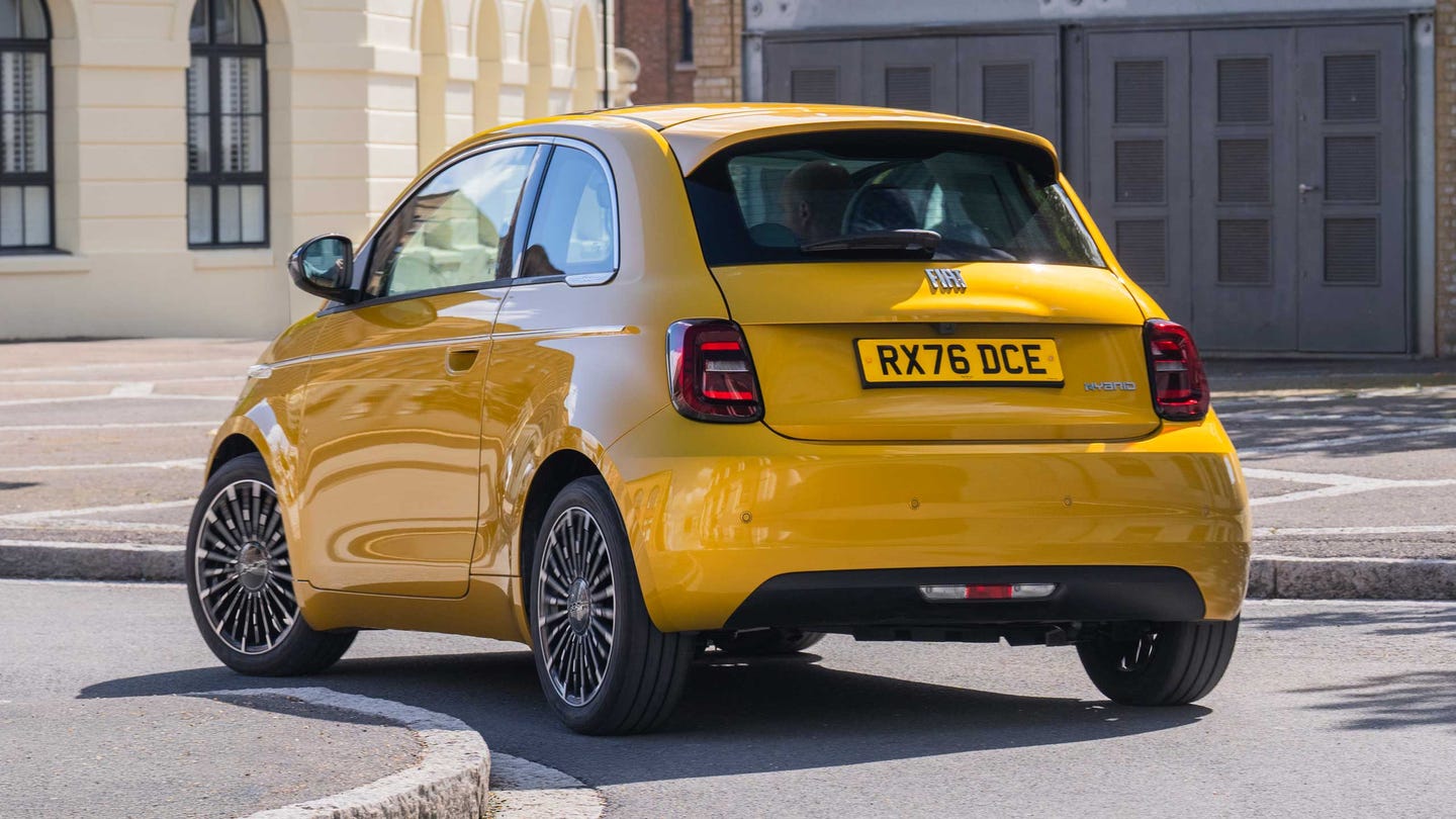 Fiat 500 Hybrid driving in city, rear view