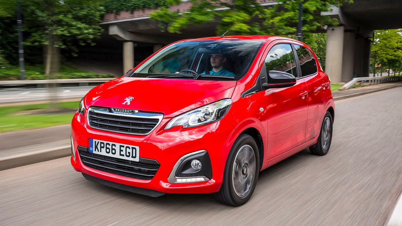 Red Peugeot 108 driving