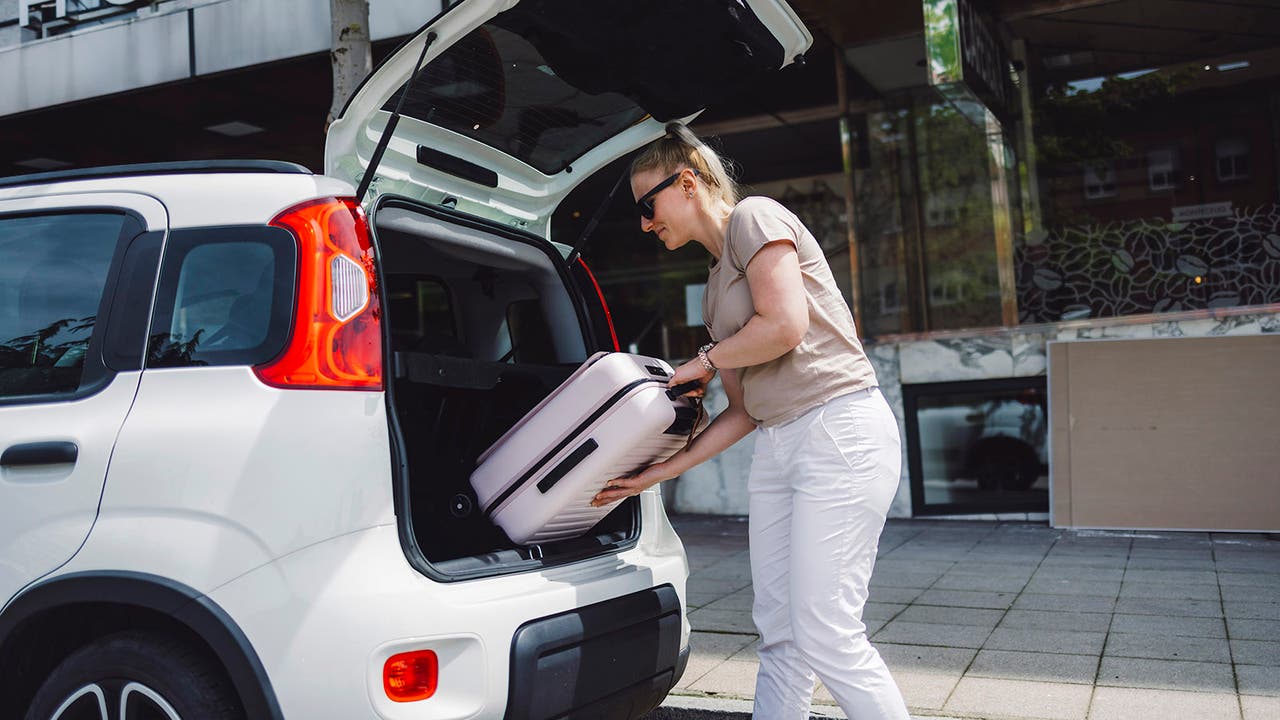 Rental car with driver loading boot