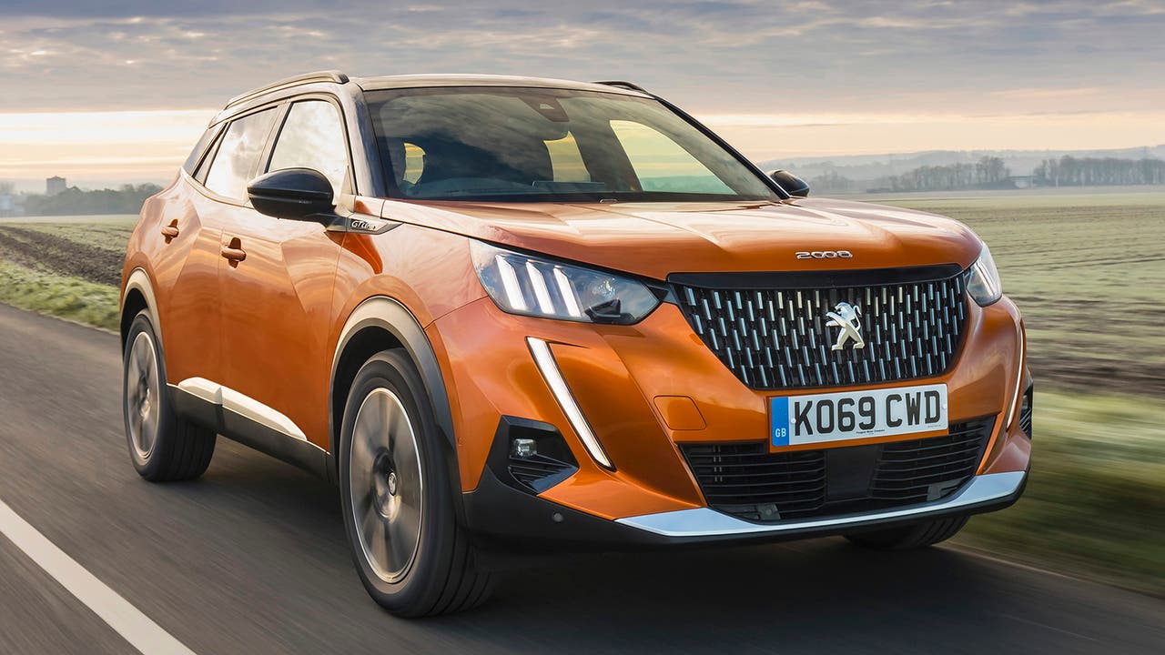 Peugeot 2008 in orange, driving shot