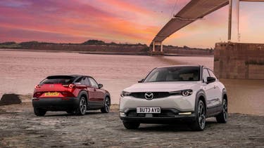 Mazda MX-30 models next to Severn Bridge