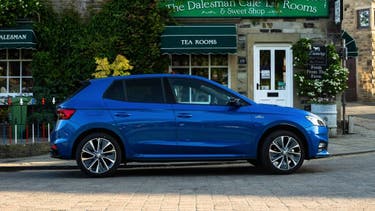 Skoda Fabia parked outside tearoom - side view