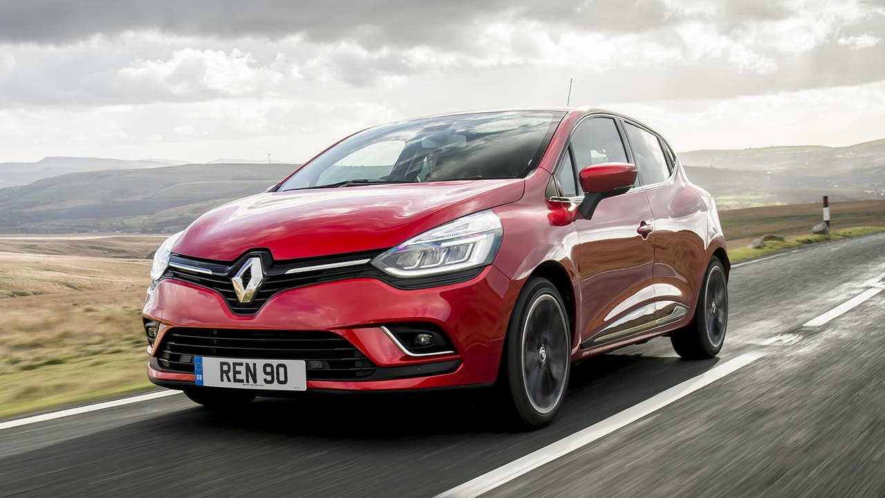 Renault Clio in red, driving shot