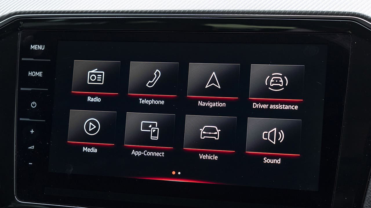 A closeup of an infotainment system showing radio and other options