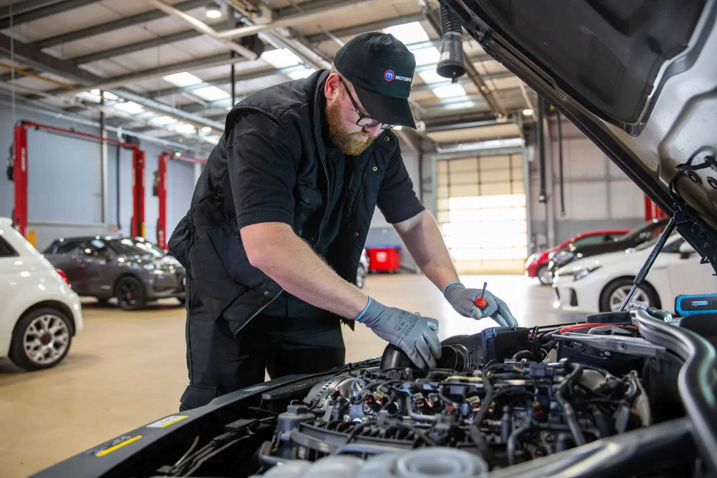 Car engine being checked 