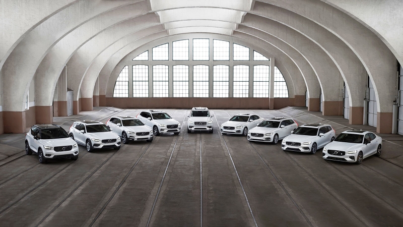 Volvo cars and SUVs parked in a large hall