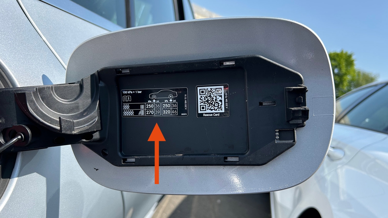 Mercedes C-Class, what are the correct tyre pressures. Tyre pressure sticker inside fuel filler with arrow highlighting it.