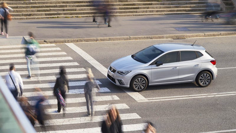 SEAT Ibiza in silver, waiting at pedestrian crossing