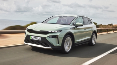 Green Skoda Elroq driving front view