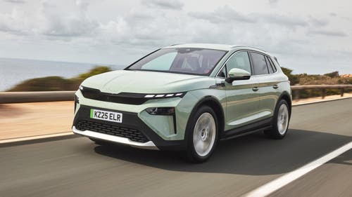 Green Skoda Elroq driving front view