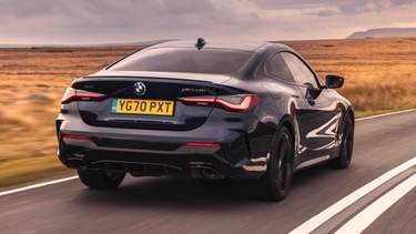 BMW 4 Series driving rear view