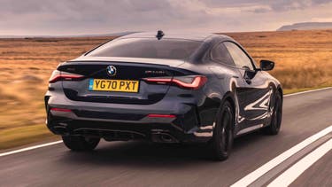 BMW 4 Series driving rear view