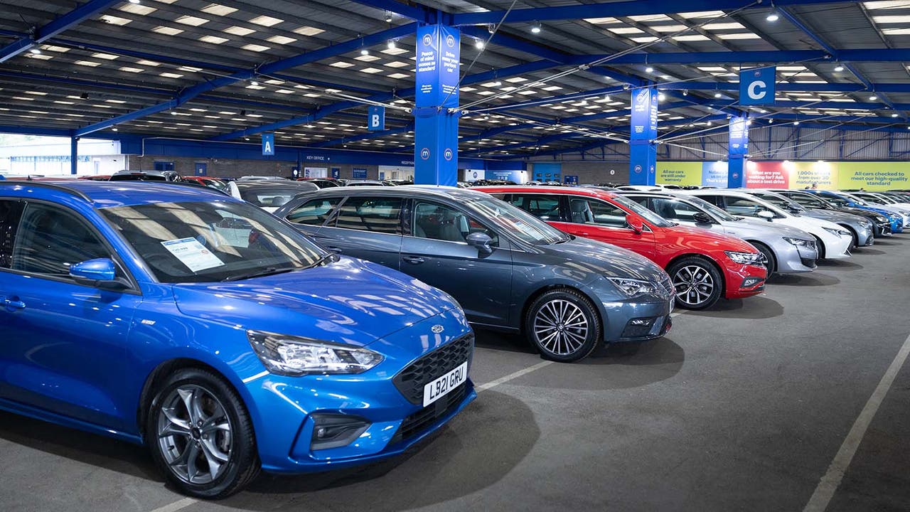 A row of used cars for sale at a Motorpoint store