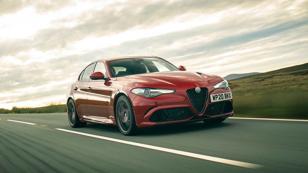 Alfa Romeo Giulia in red, driving shot