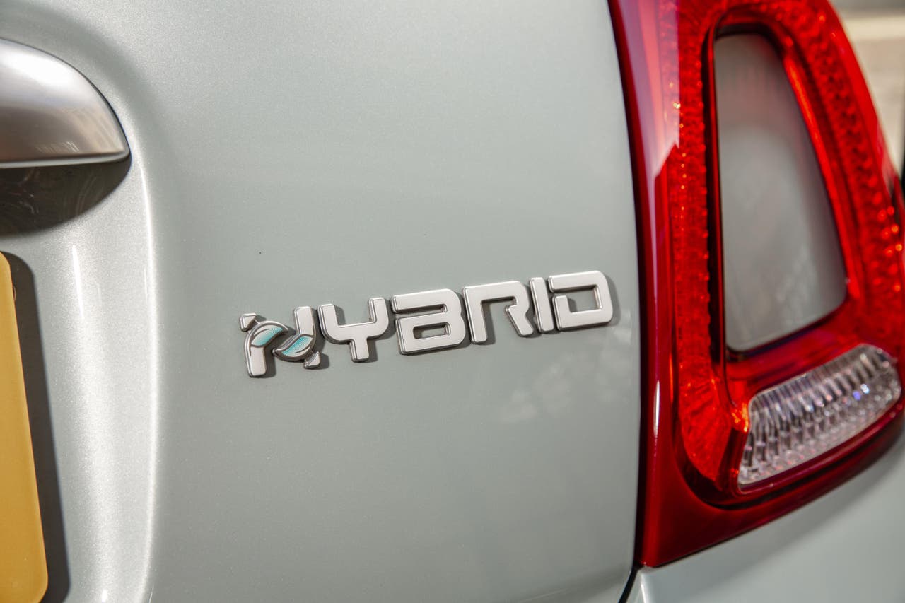 Hybrid badge on the bootlid of a grey Fiat 500
