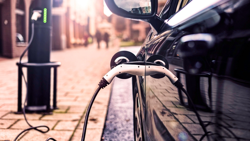 Image of an EV plugged in and charging