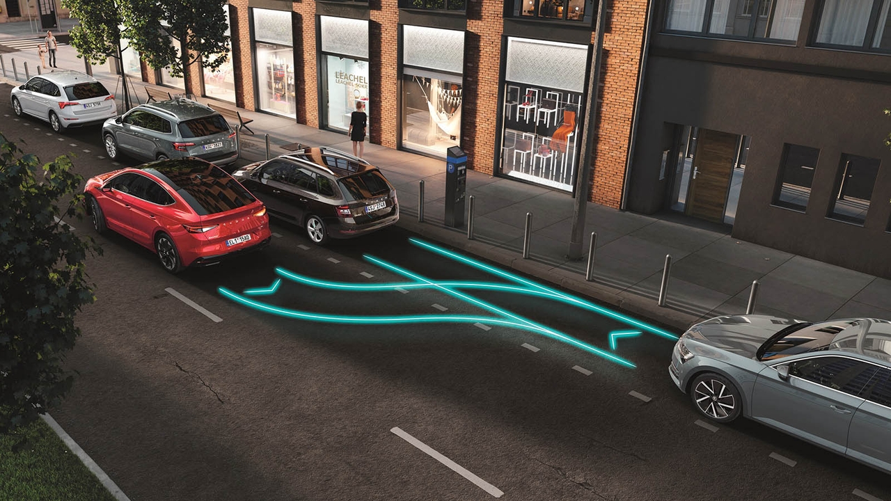 Red Skoda Enyaq Coupe using park assist to parallel park