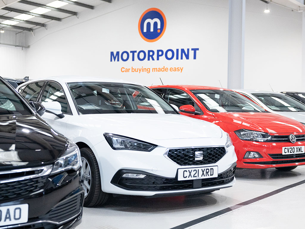 Row of cars for sale at a Motorpoint store