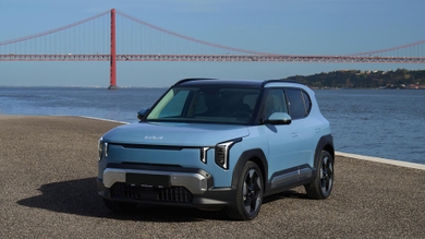 Kia EV2 in front of Lisbon bridge