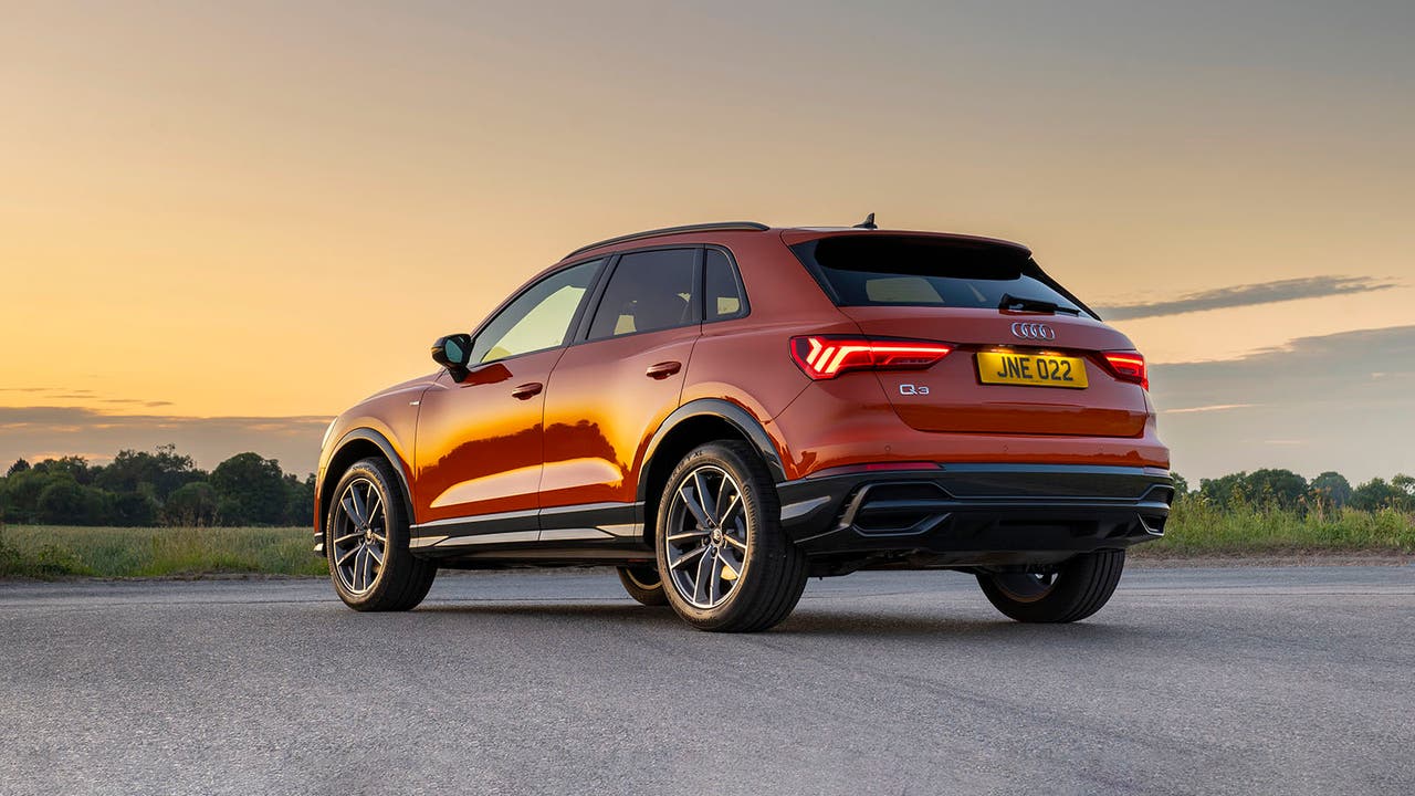 Audi Q3 orange, static rear-three-quarter shot