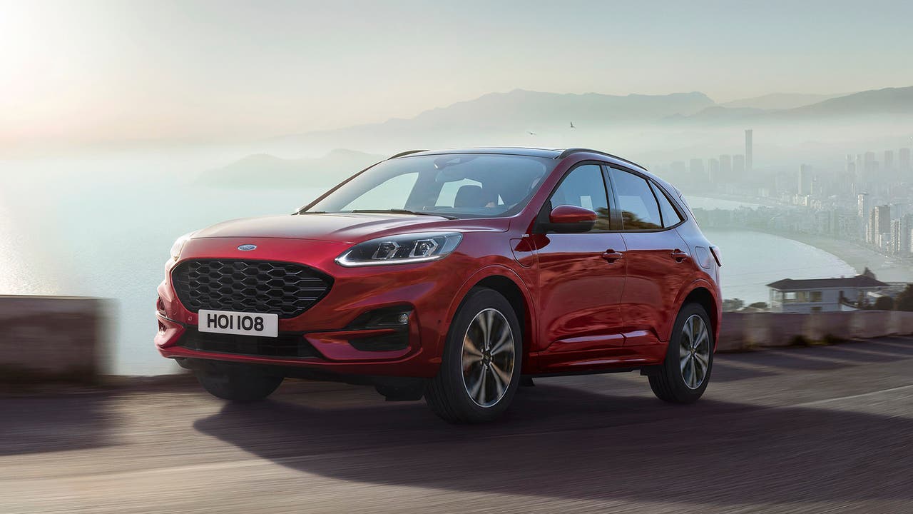 Ford Kuga in red, driving shot
