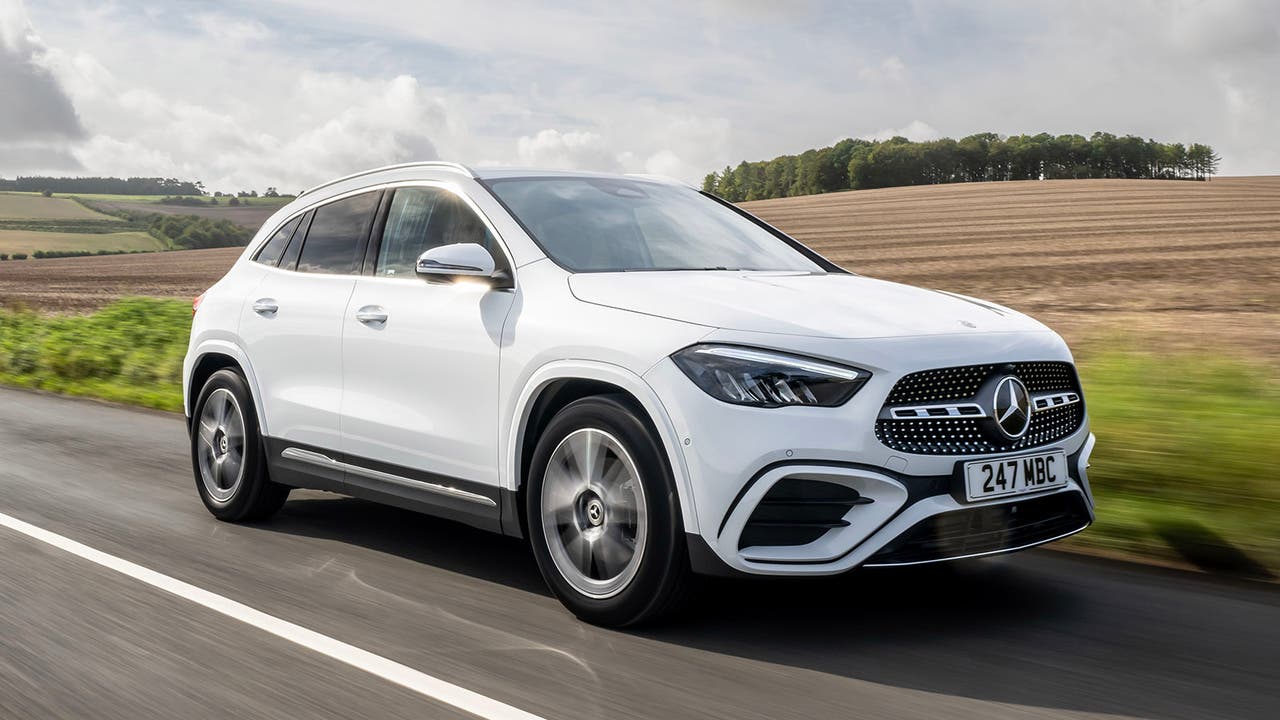 White Mercedes GLA driving