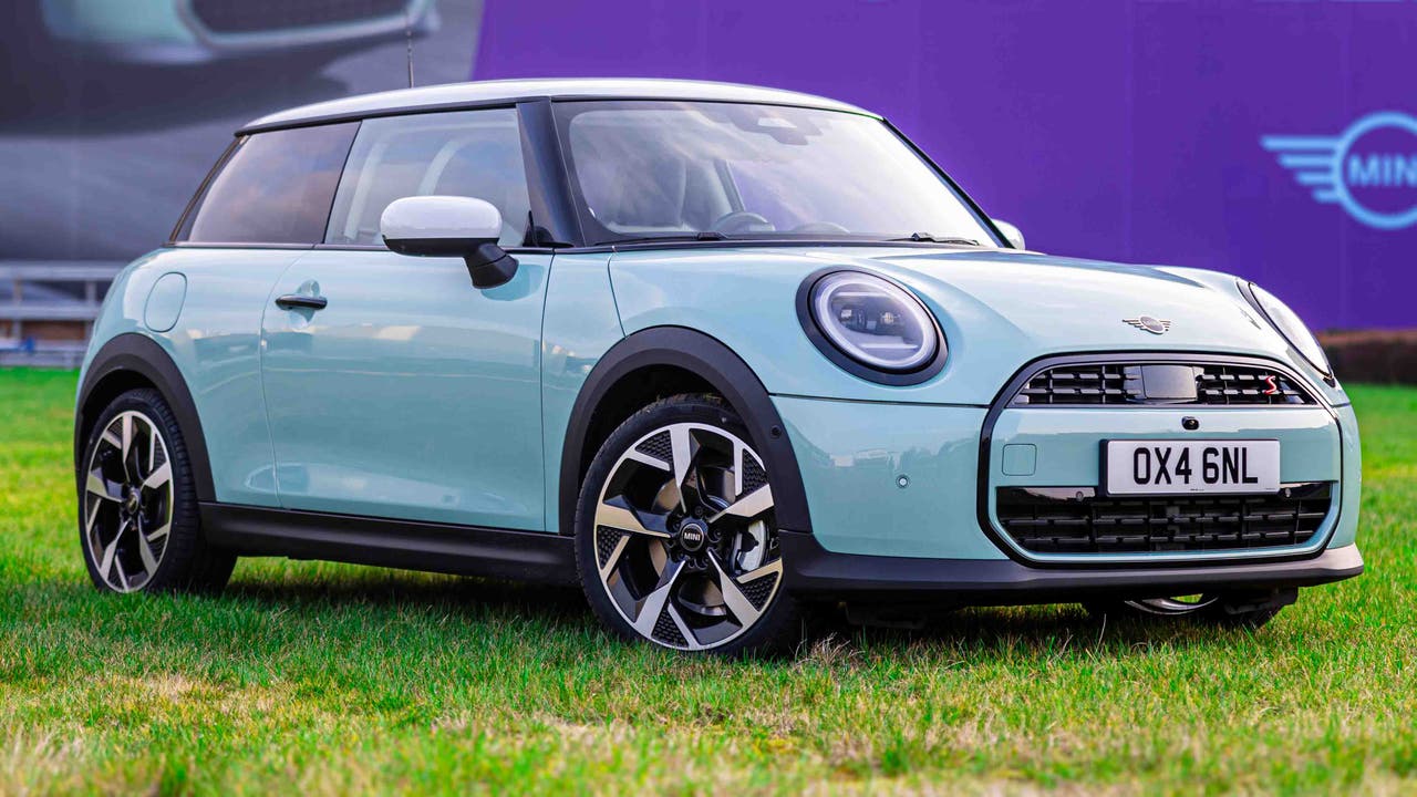 2024 Mini Cooper S in Exclusive trim with optional Ocean Wave Green paint, white roof and 18-inch alloy wheels