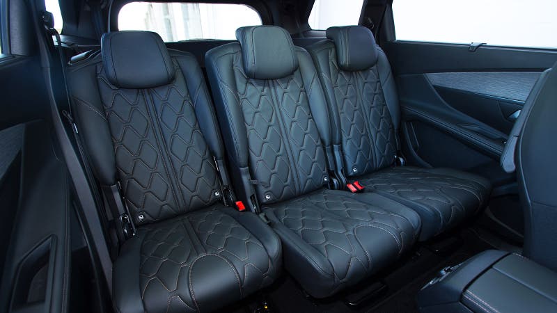 Three separate rear seats shown in the Peugeot 5008 with optional quilted leather trim