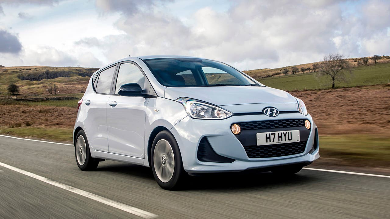 Hyundai i10 in light blue, driving shot